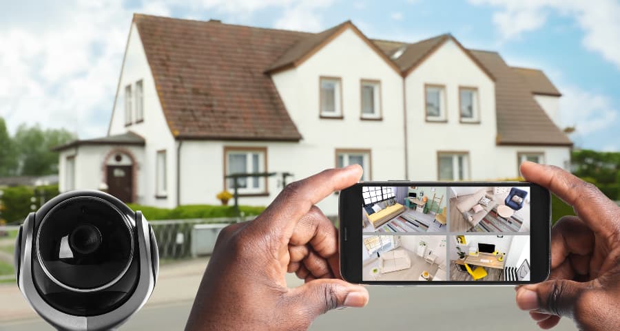 Man holding phone and viewing streams from video cameras